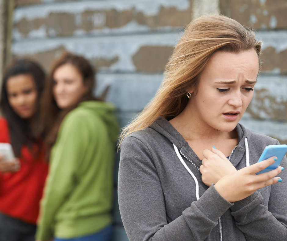 teen girl being cyberbullied